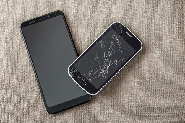 comparison-of-two-black-mobile-phones-old-cellphone-with-cracked-screen-and-new-modern-on-light-cloth-copy-space-background-technology-progress-and-replacement-concept_127089-10469.jpg